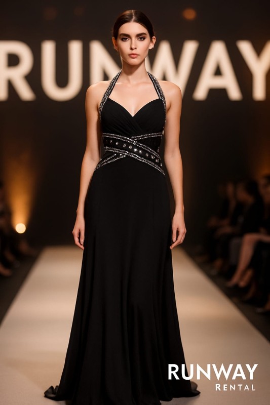 Vestido Morgan & Co negro decorado con piedras en el pecho y espalda. Cruzado en la espalda con escote hasta la cintura.